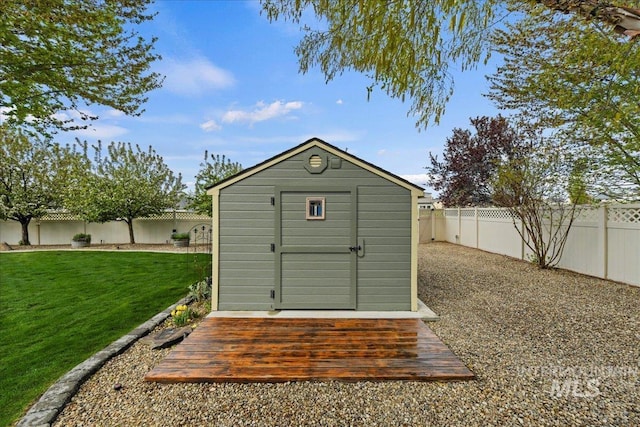 view of shed featuring a fenced backyard