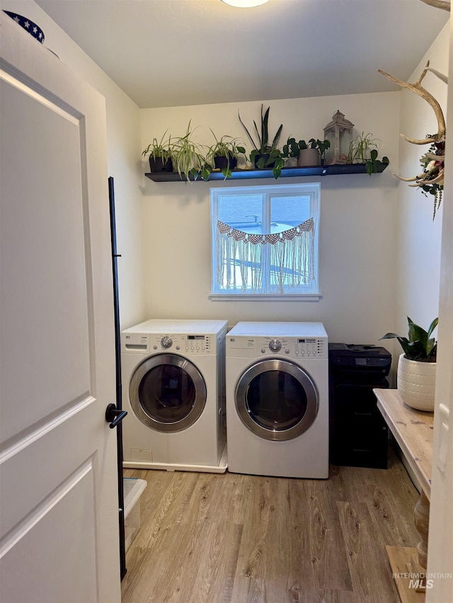 815 Emerald Dr N, Kimberly, ID 83341 - laundry room with laundry area, washer and clothes dryer, and wood finished floors