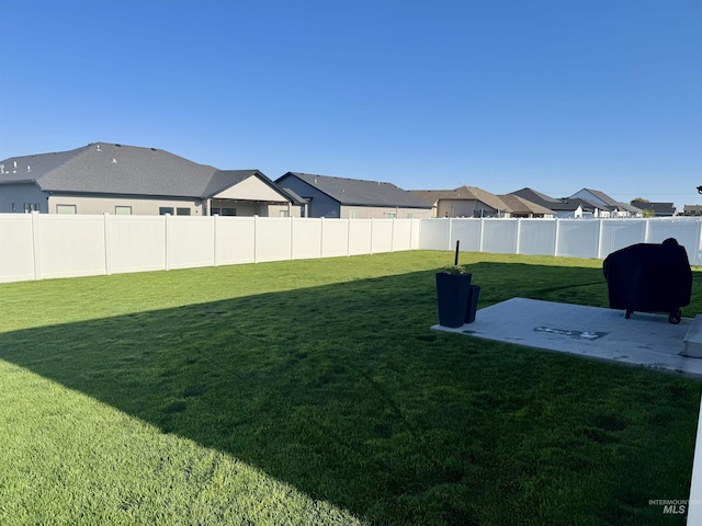 815 Emerald Dr N, Kimberly, ID 83341 - view of yard with a fenced backyard, a patio area, and a residential view