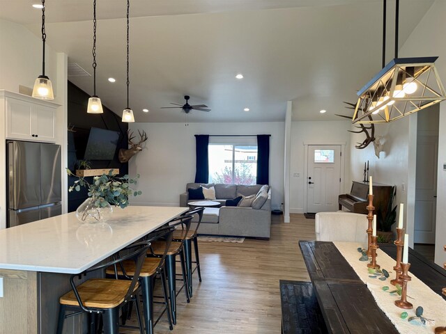 815 Emerald Dr N, Kimberly, ID 83341 - dining room featuring recessed lighting, ceiling fan, baseboards, and light wood finished floors