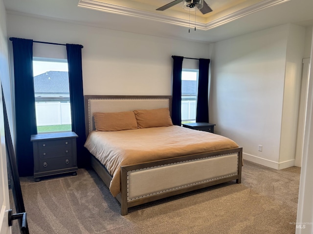 815 Emerald Dr N, Kimberly, ID 83341 - carpeted bedroom featuring baseboards, ornamental molding, a ceiling fan, and a tray ceiling