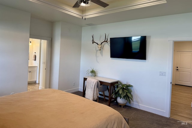 815 Emerald Dr N, Kimberly, ID 83341 - bedroom featuring baseboards, ensuite bathroom, a tray ceiling, and carpet flooring