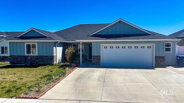 841 Gregory Way, Twin Falls, ID 83301 - view of front facade featuring board and batten siding, stone siding, concrete driveway, and a garage