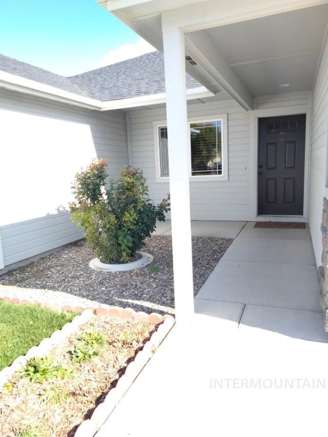 841 Gregory Way, Twin Falls, ID 83301 - doorway to property with roof with shingles