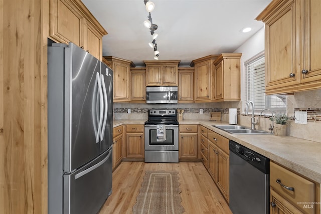 1934 N Cribbens St, Boise, ID 83713 - kitchen with appliances with stainless steel finishes, light countertops, light wood-style flooring, and tasteful backsplash