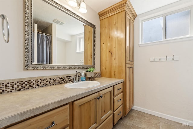 1934 N Cribbens St, Boise, ID 83713 - bathroom with vanity, plenty of natural light, and tile patterned flooring
