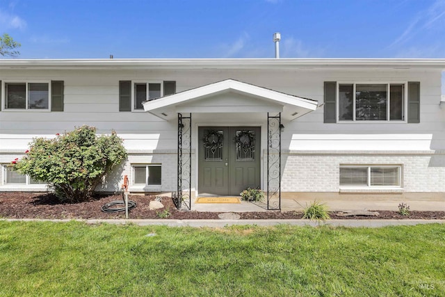 1934 N Cribbens St, Boise, ID 83713 - view of front of home featuring a front lawn and brick siding