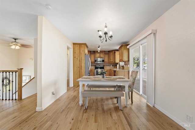 1934 N Cribbens St, Boise, ID 83713 - dining space with a chandelier, light wood finished floors, and ceiling fan