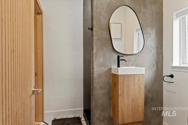 bathroom featuring plenty of natural light and vanity