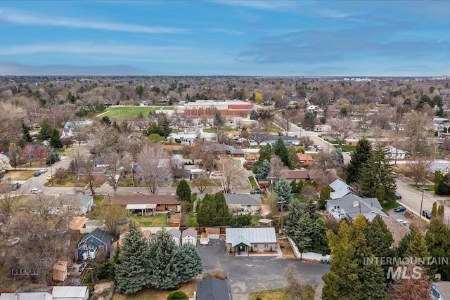 birds eye view of property with a residential view