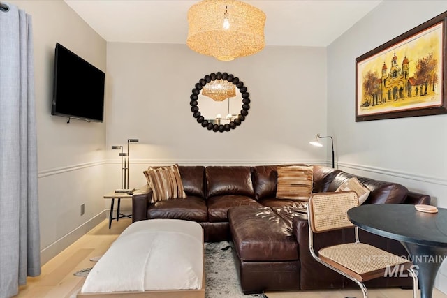 living room featuring baseboards and wood finished floors