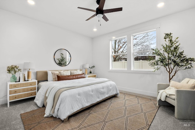 carpeted bedroom featuring ceiling fan