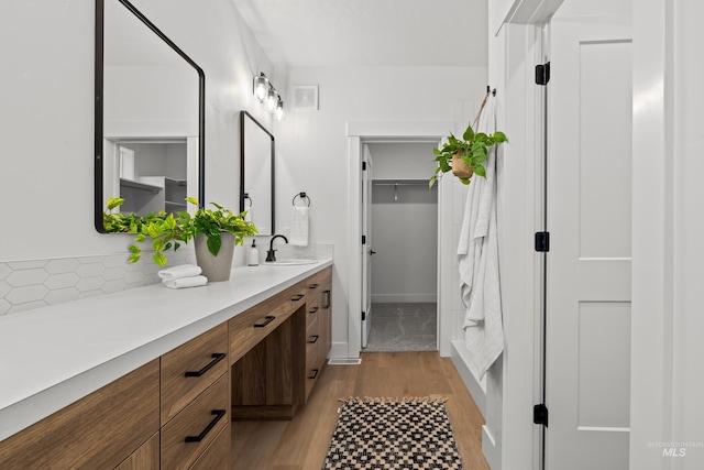 bathroom featuring vanity and hardwood / wood-style floors