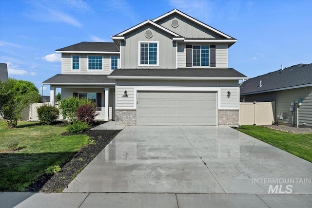4217 S Leaning Tower Ave, Meridian, ID 83624 - view of front of house with concrete driveway, a garage, and board and batten siding