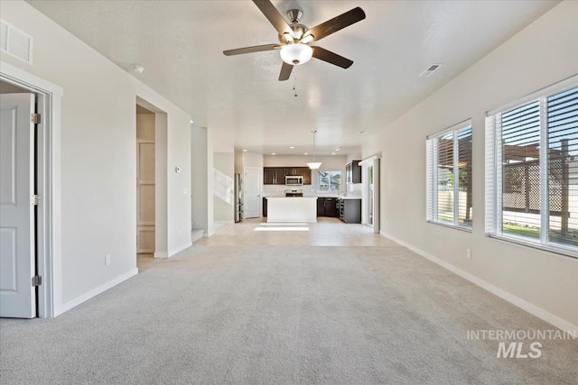 4217 S Leaning Tower Ave, Meridian, ID 83624 - unfurnished living room featuring light carpet and healthy amount of natural light