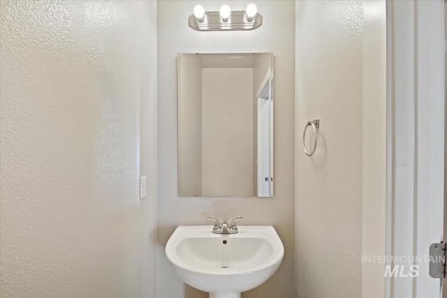 4217 S Leaning Tower Ave, Meridian, ID 83624 - bathroom with a sink and a textured wall
