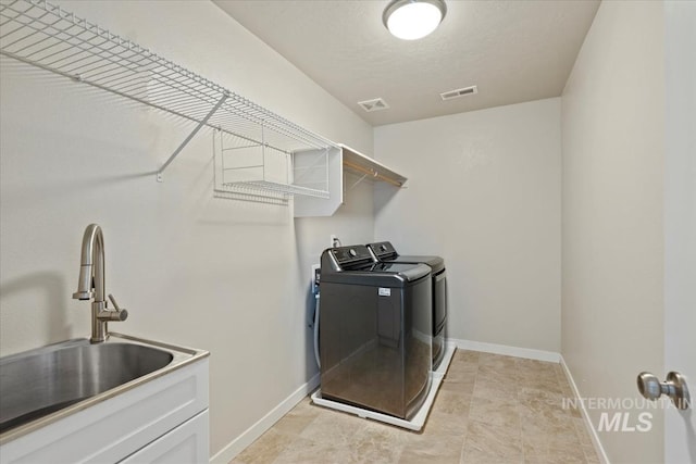 4217 S Leaning Tower Ave, Meridian, ID 83624 - laundry area featuring washer and dryer and baseboards