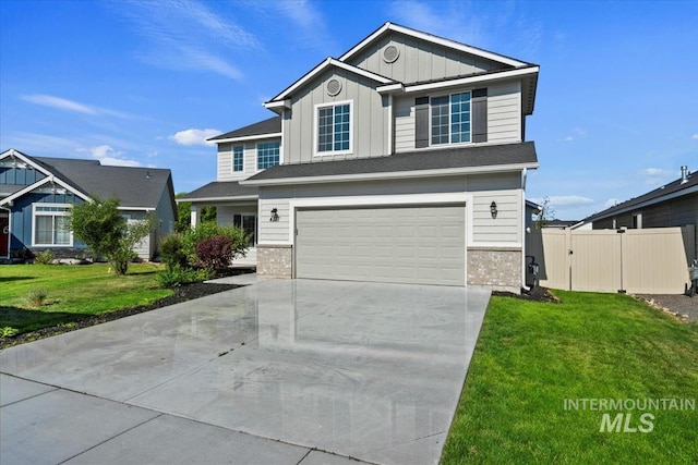 4217 S Leaning Tower Ave, Meridian, ID 83624 - view of front of property with board and batten siding, a garage, and driveway