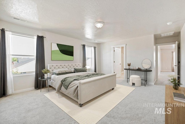 4217 S Leaning Tower Ave, Meridian, ID 83624 - bedroom with light carpet and a textured ceiling