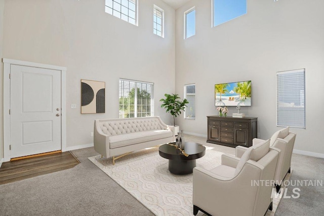 4217 S Leaning Tower Ave, Meridian, ID 83624 - living room featuring a towering ceiling, carpet floors, and healthy amount of natural light