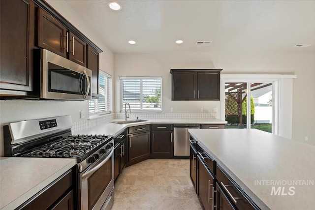 4217 S Leaning Tower Ave, Meridian, ID 83624 - kitchen featuring stainless steel appliances, recessed lighting, light countertops, and dark brown cabinets