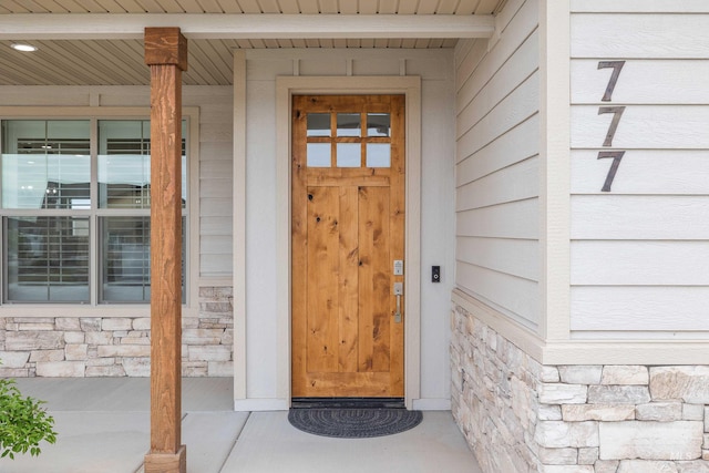 view of exterior entry with stone siding