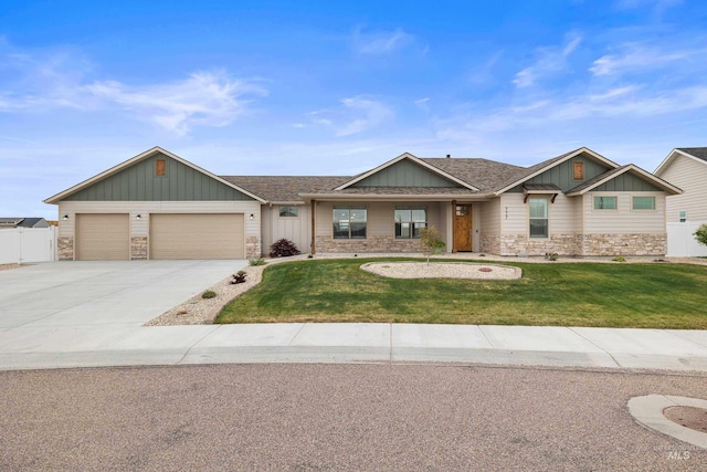 view of front of property with stone siding, an attached garage, board and batten siding, a front yard, and driveway