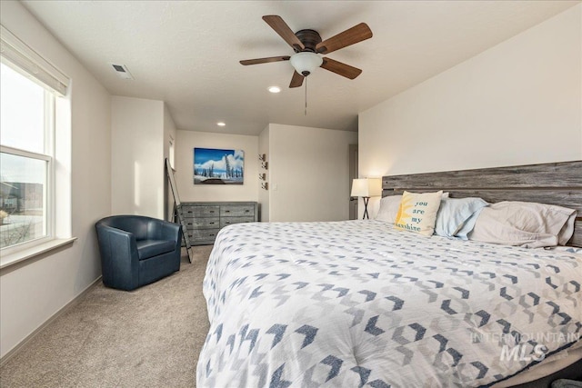 bedroom featuring carpet, visible vents, baseboards, recessed lighting, and ceiling fan