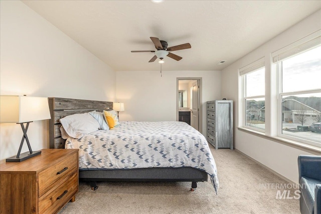 bedroom with baseboards, light carpet, and ceiling fan