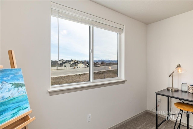 office space with carpet flooring and baseboards