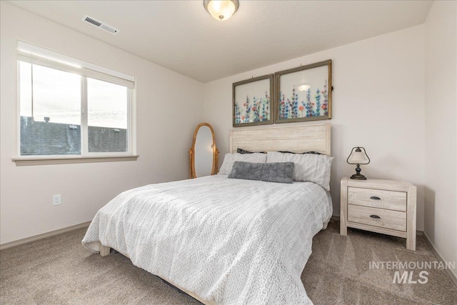 bedroom featuring visible vents, carpet floors, and baseboards