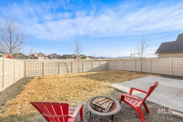 view of yard with a patio area and a fenced backyard