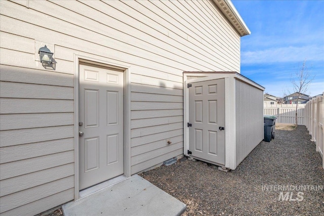 doorway to property with fence