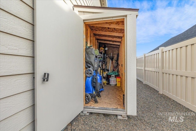 view of outbuilding with fence