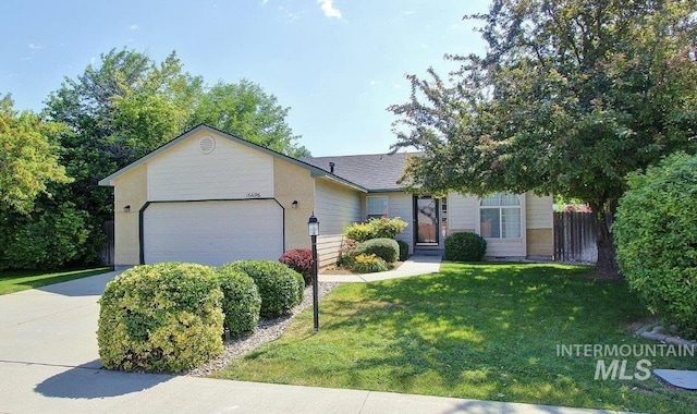 16696 Snowgoose St, Nampa, ID 83687 - view of front of home featuring an attached garage, a front yard, and concrete driveway