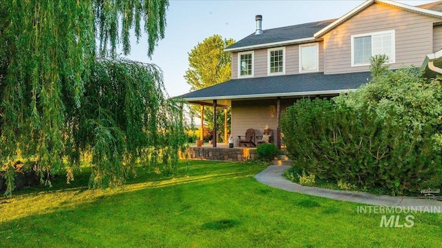 2020 Widner Rd, Midvale, ID 83645 - rear view of property with roof with shingles and a lawn