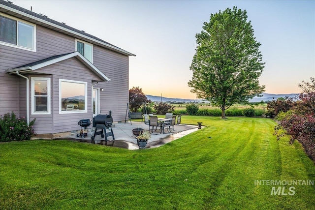2020 Widner Rd, Midvale, ID 83645 - yard at dusk featuring a patio and a lawn
