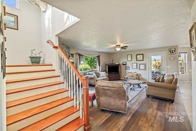 2020 Widner Rd, Midvale, ID 83645 - living room with stairway, a ceiling fan, a textured ceiling, and wood finished floors