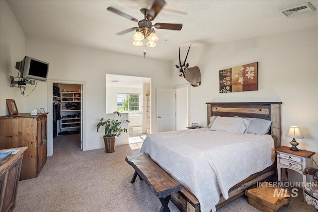 2020 Widner Rd, Midvale, ID 83645 - bedroom with a spacious closet, light carpet, a closet, ensuite bath, and ceiling fan