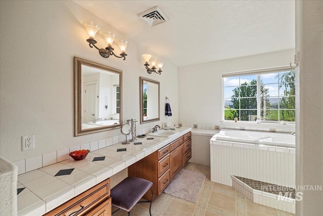 2020 Widner Rd, Midvale, ID 83645 - bathroom featuring a bath, a chandelier, and double vanity