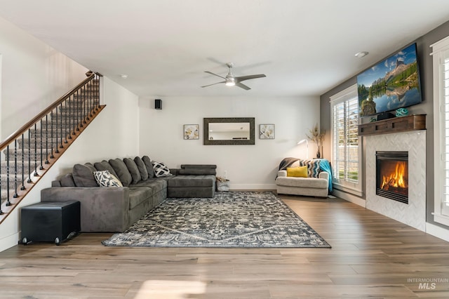 2679 S Tristram Way, Meridian, ID 83642 - living room featuring ceiling fan, stairs, wood finished floors, and a tile fireplace