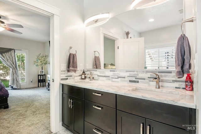 2679 S Tristram Way, Meridian, ID 83642 - bathroom with double vanity, backsplash, ceiling fan, and recessed lighting