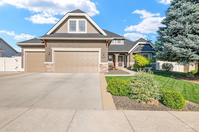 2679 S Tristram Way, Meridian, ID 83642 - craftsman-style home with stone siding, driveway, stucco siding, and an attached garage