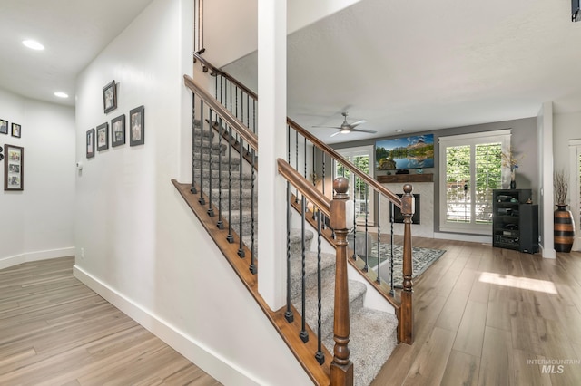 2679 S Tristram Way, Meridian, ID 83642 - stairway with wood finished floors, ceiling fan, baseboards, and recessed lighting