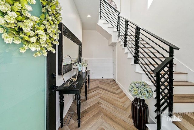 entryway with light parquet floors