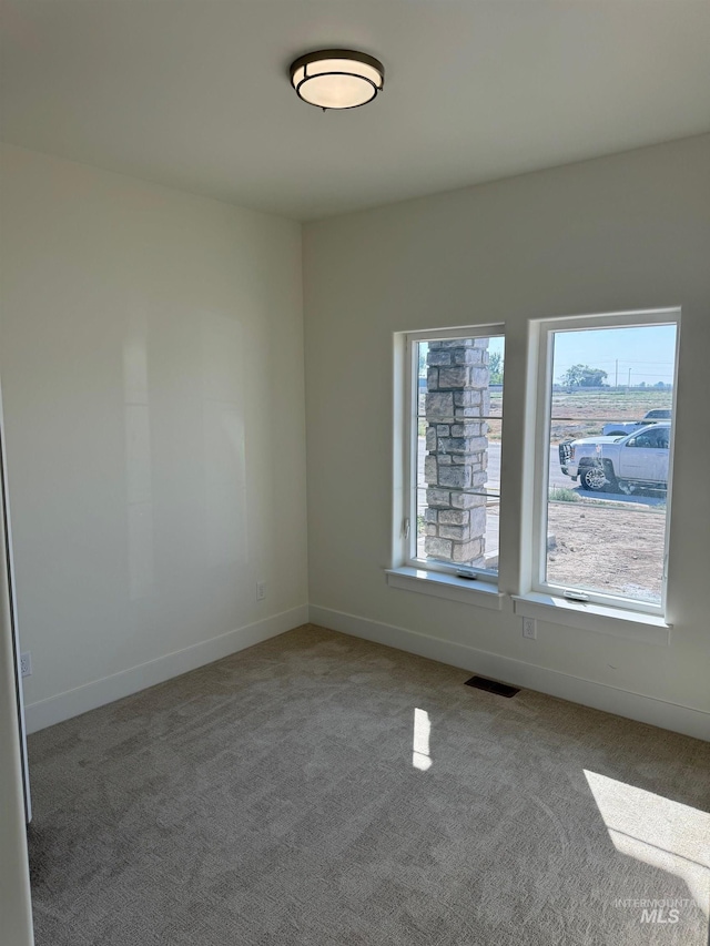 spare room featuring carpet flooring