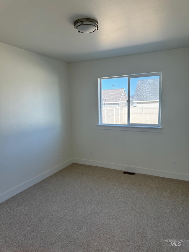 empty room with carpet flooring