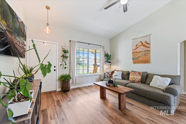 3318 E Princess Amy Ct, Nampa, ID 83687 - living area with wood finished floors, ceiling fan, vaulted ceiling, and baseboards