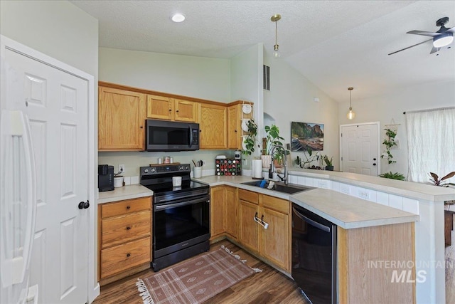 3318 E Princess Amy Ct, Nampa, ID 83687 - kitchen featuring electric range oven, black dishwasher, a sink, a peninsula, and light countertops