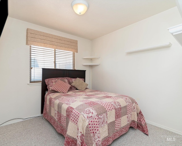 carpeted bedroom with baseboards